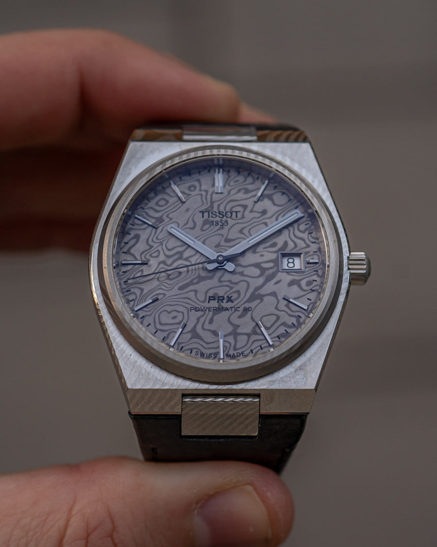 Hands-on: Tissot PRX Powermatic 80 – Nytt liv i 38 mm med titan och Damascus-stål